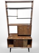 A 20th century G-plan teak and ebonised room divider designed by E.