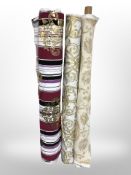 Three rolls of upholsterer's fabric / material, width approximately 140 cm, length unknown.