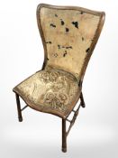 A Victorian mahogany occasional chair in studded floral upholstery