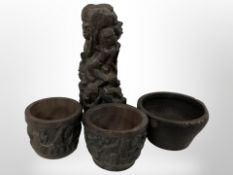 An African hardwood figural carving and three similar bowls