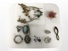A group of vintage and contemporary brooches and six pairs of earrings.