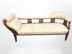 A Victorian carved walnut chaise longue,