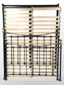 A reproduction painted metal 4'6 bed frame and mattress base