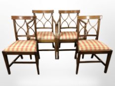 A set of four inlaid mahogany dining chairs