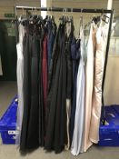 A rail of approximately nineteen lady's evening dresses