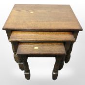 A reproduction oak nest of tables,