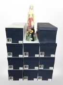 11 matching Old Tupton Ware pottery figures of a lady in a floral dress, height 30cm, all boxed.
