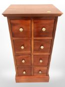 A reproduction hardwood eight drawer chest,
