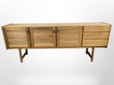 A 20th century teak G Plan four door low sideboard,