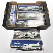 Six Hess plastic scale models including truck and space shuttle with satellite, fire truck, etc.