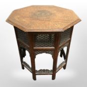 A Moorish hardwood and brass inlaid octagonal occasional table,