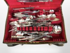 An oak canteen containing assorted Community stainless steel cutlery, canteen 60cm wide.