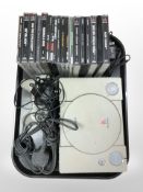 A Sony Playstation 1 with lead, controller, and a quantity of games.