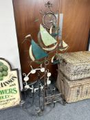 Two wrought metal chandeliers and a further easel stand depicting sailing boats