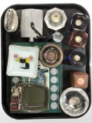 A group of paperweights inset with coins, Lesney ceramic ashtray surmounted by a car,