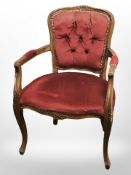 A carved and stained beech salon armchair