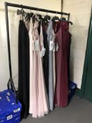 A rail of approximately nineteen lady's evening dresses
