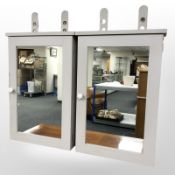 A pair of contemporary mirrored wall cabinets,