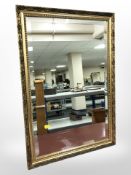 A contemporary gilt and bevelled mirror,