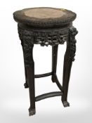 A 19th century Chinese carved hardwood and rouge marble inset plant stand,