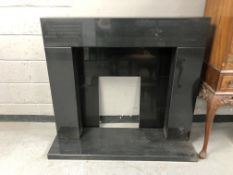 A modern marble fire surround,
