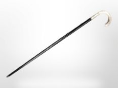 An ebonised walking cane with silver handle, engraved 'Captain Allan Moat, 2 Janvier 1974 M.V. C.P.