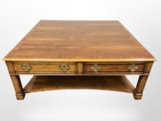 A large reproduction yewwood square coffee table fitted with drawers,