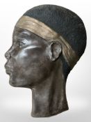 A terracotta wall plaque depicting an African man, length 39cm.