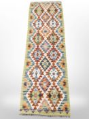 A Chobi Kilim runner, 188cm x 60cm.
