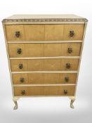 A seven piece birdseye maple bedroom suite comprising of two double door wardrobes,