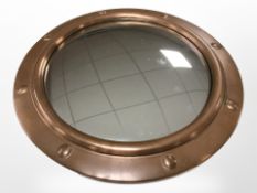 A copper-framed porthole-style convex mirror, diameter 30cm.