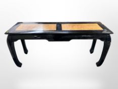 A modern Chinese style lacquered elm side table,