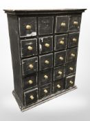An ebonised twenty-drawer chest,