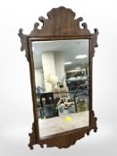A walnut mirror in the Chippendale style, length 67cm.
