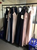 A rail of approximately nineteen lady's evening dresses