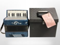 A Russian piano accordion in carry case.
