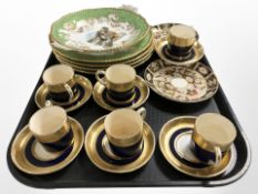 A set of six Minton porcelain coffee cans and saucers on cobalt blue ground with gilding,