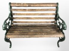 A teak and cast iron garden bench,