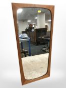 A 1970's teak framed mirror,