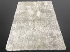 A contemporary machined shaggy pile rug, 170cm x 122cm.