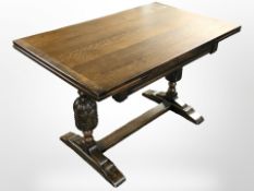 An oak pull out extending refectory dining table,