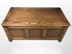 A panelled oak blanket chest,