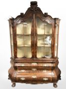 A 20th century Dutch burr walnut bombe glazed double door display cabinet fitted with three drawers
