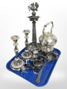 An ornate silver-plated smoker's stand, spirit kettle on burner, pair of candlesticks,