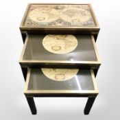 A nest of three hardwood and brass mounted atlas tables,