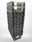 Ten stackable plastic storage boxes with folding lids,