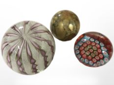 A Latticino Italian glass paperweight, a further Millefiori paperweight,