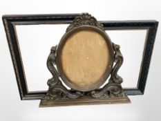 A carved beech oval frame, height 72cm, and two further ebonised picture frames.