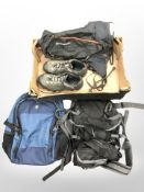 Three rucksacks and a pair of hiking shoes.