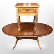 A reproduction mahogany oval coffee table,